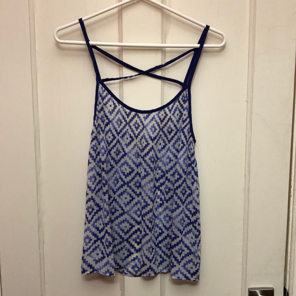 Blue and white tank top with chevron pattern and criss cross straps in back